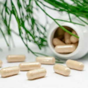Vitamin capsules with greenery