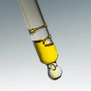 Gold face oil in a glass dropper